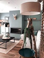 a room with a lamp and a fireplace