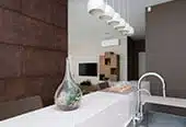 a kitchen counter with a vase on it