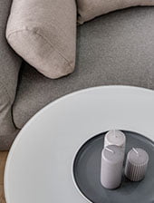 a white round table with candles on it